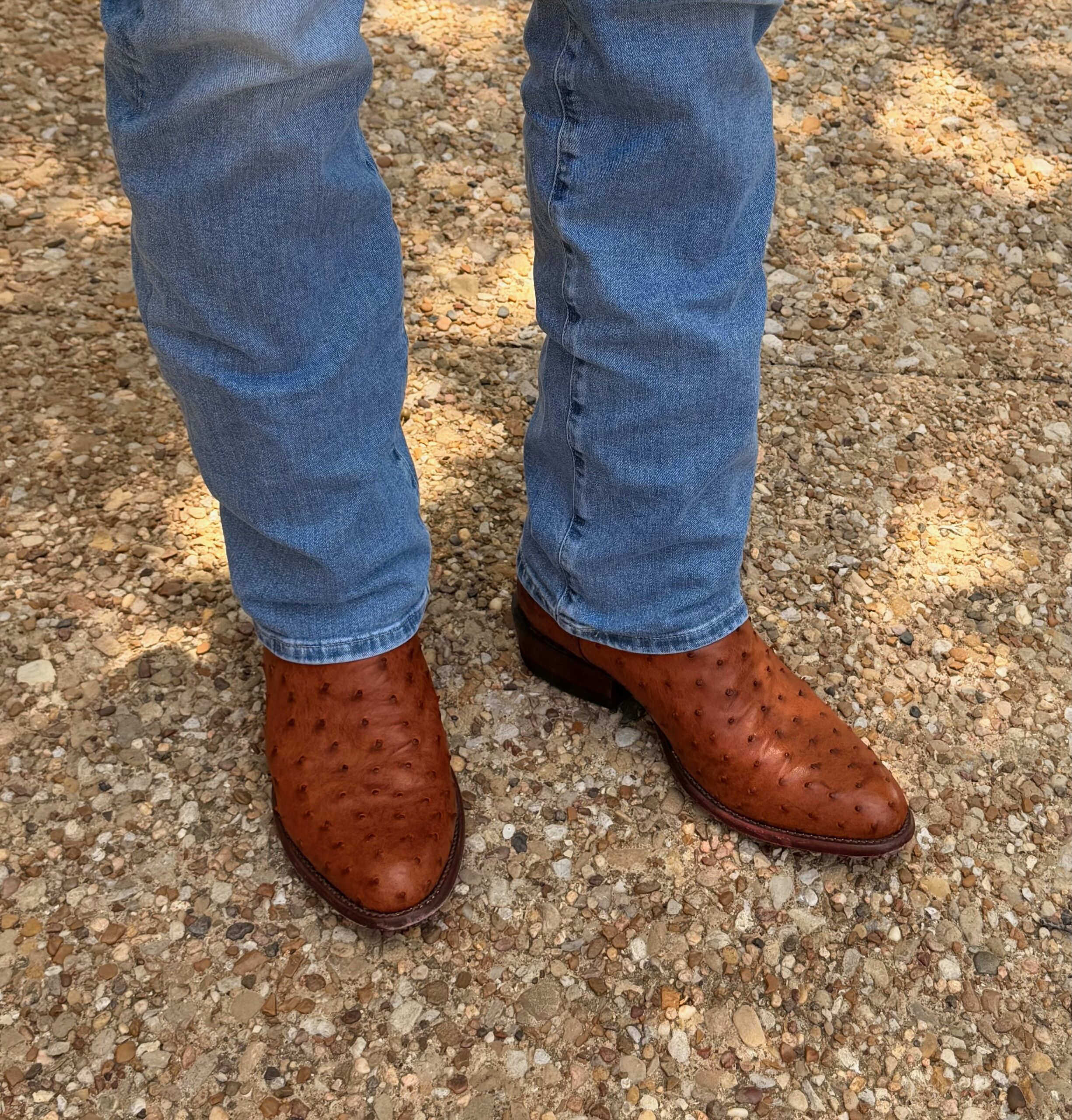 Jeans breaking over Tecovas ostrich boots, fitted at The Man's Shop, Arlington, Texas