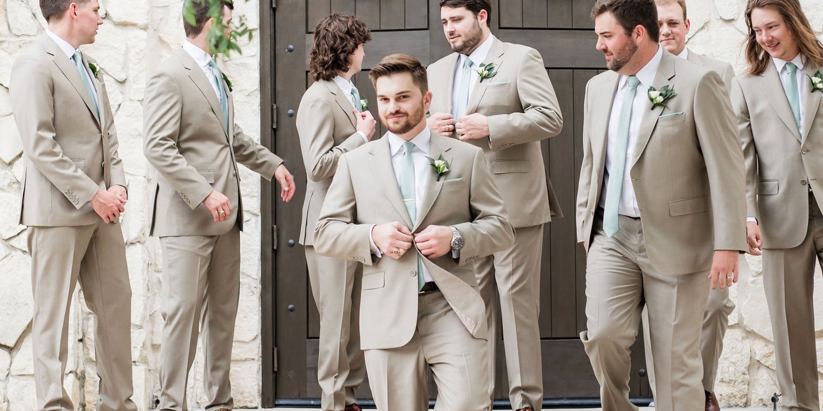 Groom and groomsmen in tan custom suits from The Man's Shop in Arlington, Texas