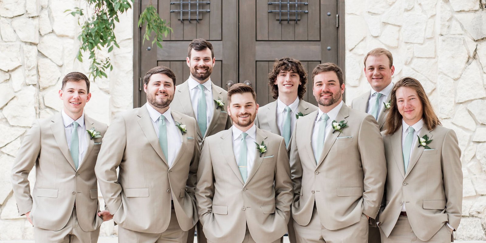 Groom in a tan custom wedding suit from The Man's Shop, Arlington, Texas