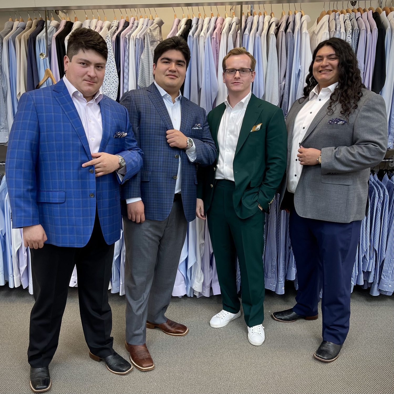 Four Man's Shop clients in fitted sport coats in the Arlington, Texas shop